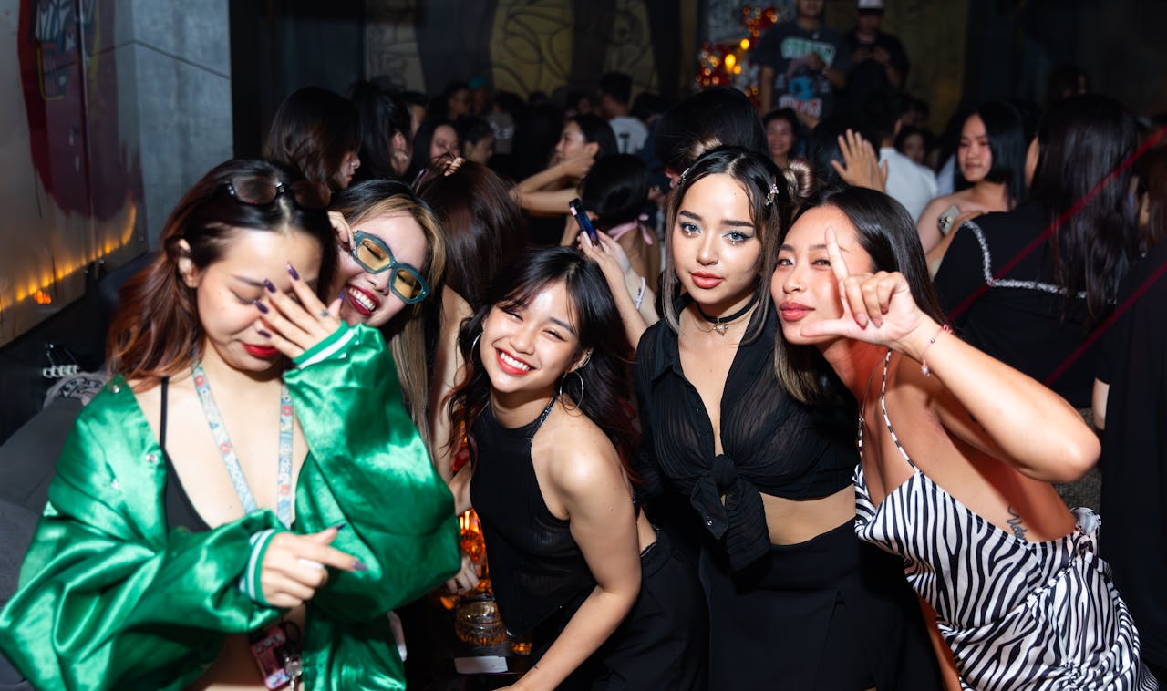 Group of friends enjoying a lively night out at a club in Hà Nội, Việt Nam.